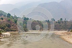 Mountain landscape and rafting on the river