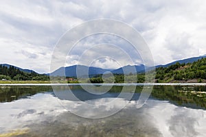 Mountain landscape reflectin in Campul lui Neag lake photo