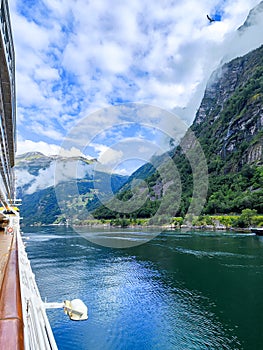 Mountain landscape with a river and Cruise shipi in the fjord in Norway