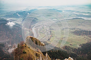 Mountain landscape, river and village below