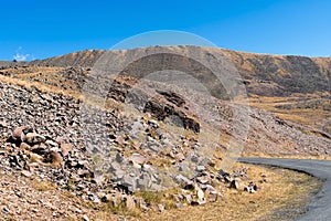 Mountain landscape with stone scree on the mountainside.