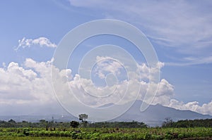 Mountain landscape and sunny clouds