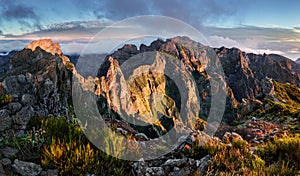 Mountain landscape at sunset in Madeira. Amazing view on colorful clouds and layered mountains