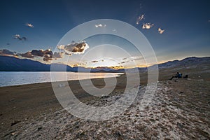 Mountain landscape at sunset. Outstanding view of the mountain ridges and clouds. Mountain Lake in Altai of Mongolia