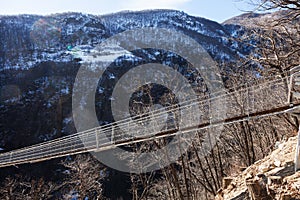 Mountain landscape with suspension bridge