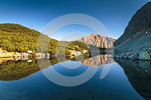 Mountain landscape with tarn at autumn.