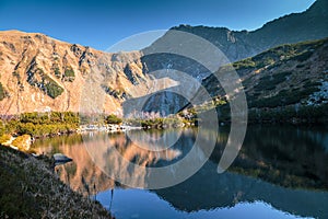 Mountain landscape with tarn at autumn.