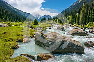 Mountain landscape with a turbulent river, Kyrgyzstan. photo