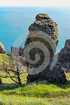 Mountain landscape, vertical weathered volcanic rocks on the slopes of the mountains