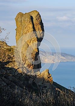 Mountain landscape, vertical weathered volcanic rocks on the slopes of the mountains