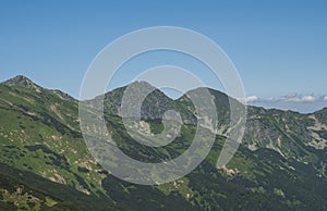 Mountain landscape of Western Tatra mountains or Rohace with view on ostry rohac two peaks from hiking trail on Baranec