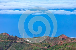 Mountain landscape with white clouds and blue sky