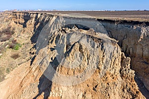 Mountain landslide in an environmentally hazardous area. Large crack in ground, descent of large layers of dirt. Deadly danger at