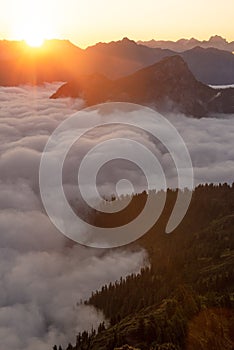 Mountain layers above fog at first light