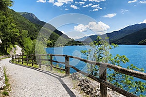 Mountain Ledro lake and bike path in the Italian Dolomites