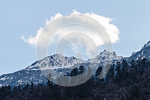 Mountain with little snow and cloud on the top sunlight in the morning in winter at Lachen in North Sikkim, India