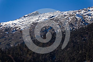 Mountain with little snow on the top sunlight in the morning at Lachen in North Sikkim, India