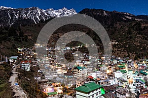 Mountain with little snow on the top with village in the night at Lachen in North Sikkim, India