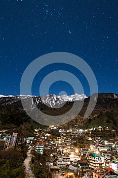 Mountain with little snow on the top with village in the night at Lachen in North Sikkim, India