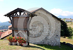 Mountain lodge made of stone and sloping roof