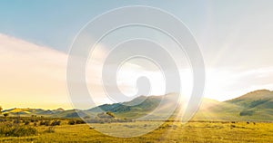 Mountain meadow time-lapse at the summer or autumn sunrise time. Wild nature and rural field. Clouds movement, green