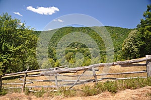 Mountain meadow with wood fence