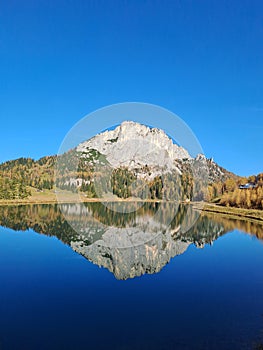 Mountain mirrowed in lake in Austria, Fall / Autumn