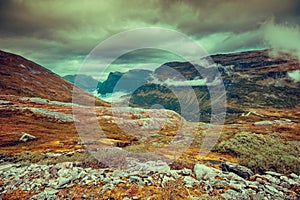 Mountain misty autumn landscape with cloudy sky