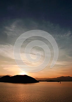 Mountain, ocean, cloud and the gradient sky at sunset