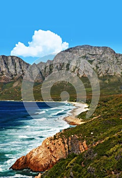 Mountain, ocean and landscape with nature, waves and surf with coastline and outdoor travel destination. Cliff, Earth