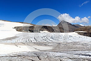 Mountain panorama, alpine hut Oberwalderhütte and glacier Pasterze with icefall Hufeisenbruch and crevasses in Glockner Group,
