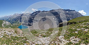 mountain panorama with deep blue lake Iffigsee in Swiss bernese alps