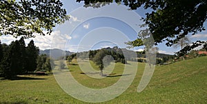 mountain panorama with green meadows and mountains in summer