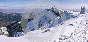 Mountain panorama with mountaineers , in winter