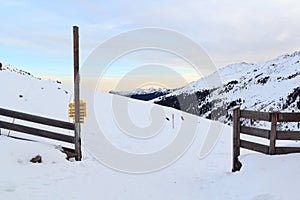 Mountain panorama with snow and sunrise in winter in Stubai Alps