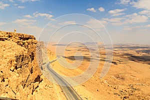 Mountain panorama and street in crater Makhtesh Ramon, Negev Desert, Israel