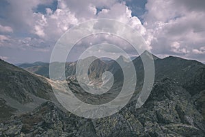 Mountain panorama from top of Banikov peak in Slovakian Tatra mountains with rocky landscape and shadows of hikers in bright day