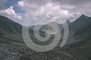 Mountain panorama from top of Banikov peak in Slovakian Tatra mountains with rocky landscape and shadows of hikers in bright day