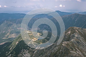 Mountain panorama from top of Banikov peak in Slovakian Tatra mountains with rocky landscape and shadows of hikers in bright day