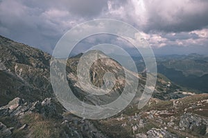 Mountain panorama from top of Banikov peak in Slovakian Tatra mountains with rocky landscape and shadows of hikers in bright day