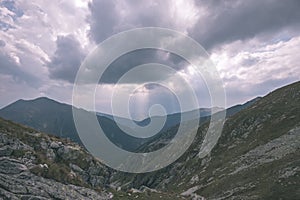 Mountain panorama from top of Banikov peak in Slovakian Tatra mountains with rocky landscape and shadows of hikers in bright day