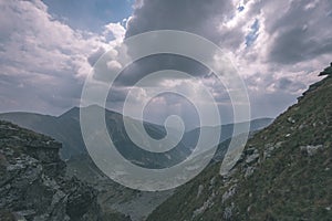 Mountain panorama from top of Banikov peak in Slovakian Tatra mountains with rocky landscape and shadows of hikers in bright day