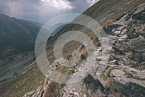 Mountain panorama from top of Banikov peak in Slovakian Tatra mountains with rocky landscape and shadows of hikers in bright day