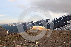 Mountain panorama view with flag seen from Großer Burgstall in Glockner Group, Austria