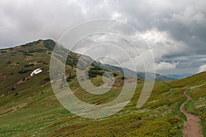 Mountain pass Bublen, path to Maly Krivan, national park Mala Fatra, Slovakia, in spring cloudy day