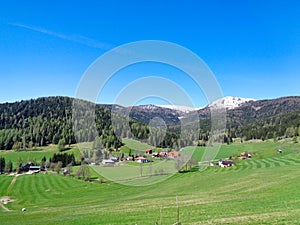 a mountain pasture in austria spring time blue sky