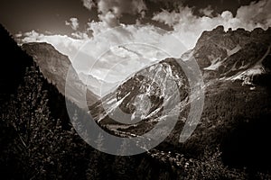 Mountain and pastures landscape in French alps. Black and white photography