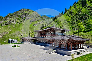 Beside the mountain path of the Tianshan Mountains, there is a beautiful and solemn temple where people pray for blessings