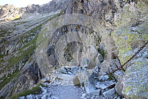 Mountain pathway secured with chain near Rysy peak, High Tatras