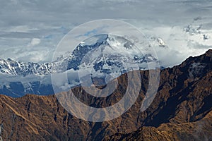 Mountain peak Chaukamba in clouds, the Himalayas